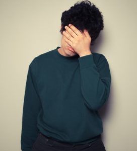 Stock Photo Man Covering Face Cropped